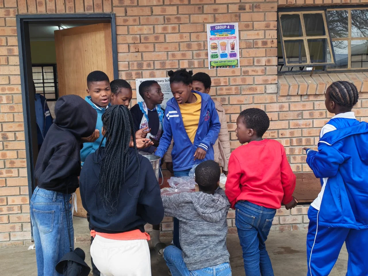 Volunteers packing food parcels for families in the monthly food programme