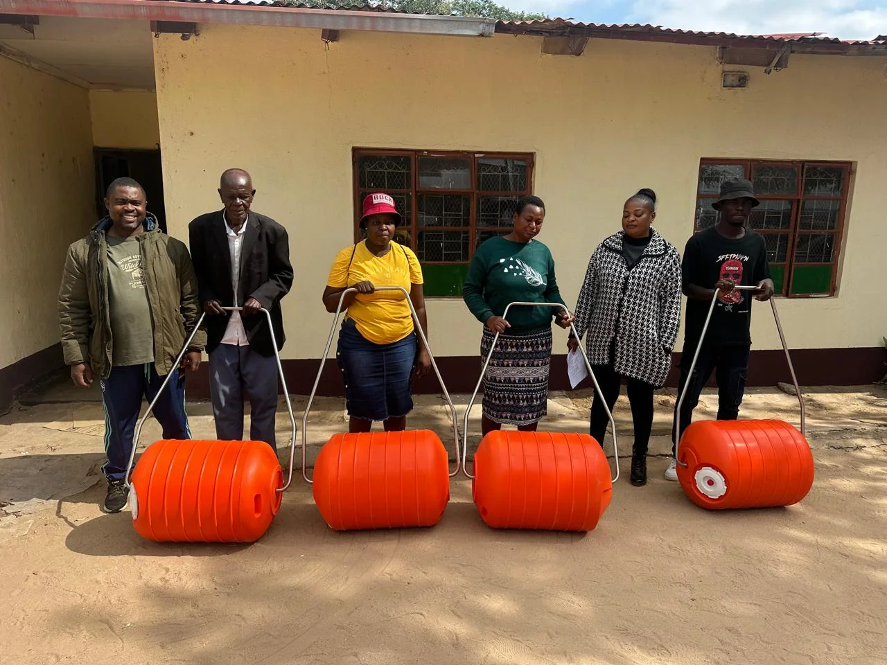 Water containers carried home in a rural village